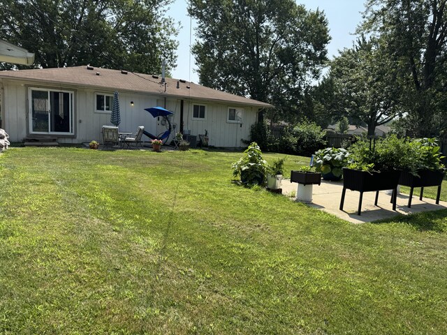 39909 Bridgeview St, Harrison Township, MI 48045 - back of house with a patio area and board and batten siding