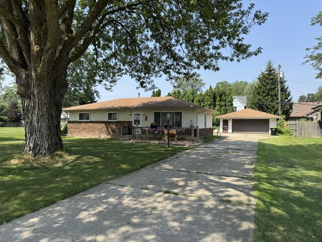 39909 Bridgeview St, Harrison Township, MI 48045 - ranch-style house featuring a front lawn, an outdoor structure, a detached garage, and brick siding