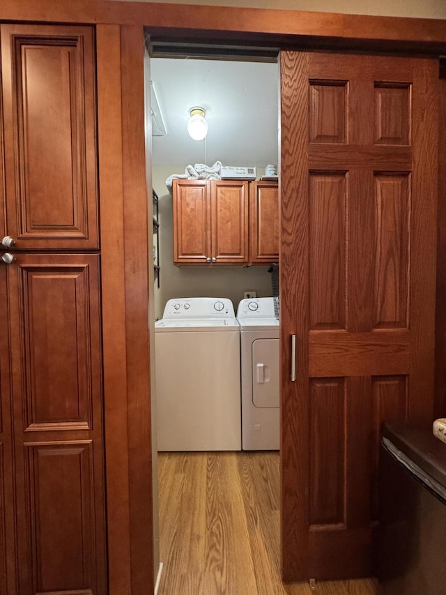 39909 Bridgeview St, Harrison Township, MI 48045 - laundry area with cabinet space, washer and dryer, and light wood finished floors