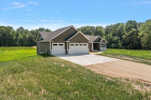 6766 Baldwin St, Hudsonville, MI 49426 - craftsman inspired home featuring an attached garage, driveway, stone siding, a front lawn, and a forest view