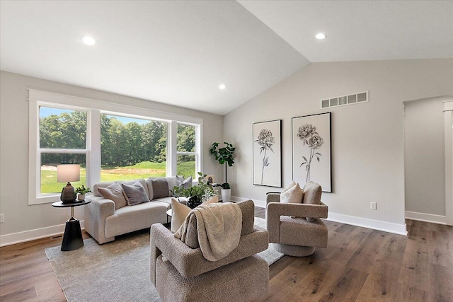 6766 Baldwin St, Hudsonville, MI 49426 - living room featuring wood finished floors, recessed lighting, and high vaulted ceiling
