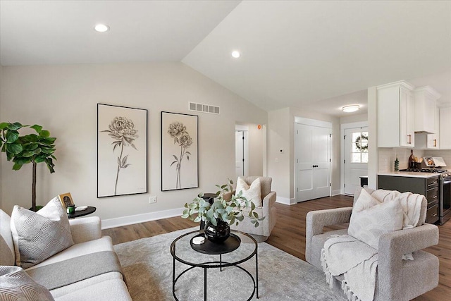 6766 Baldwin St, Hudsonville, MI 49426 - living area with lofted ceiling, dark wood-style floors, and recessed lighting