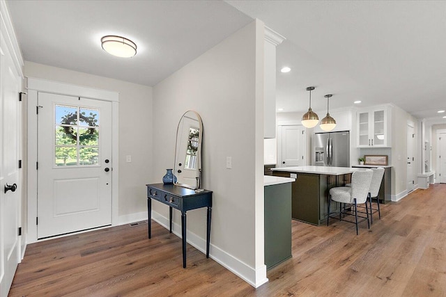 6766 Baldwin St, Hudsonville, MI 49426 - entrance foyer with light wood finished floors and recessed lighting