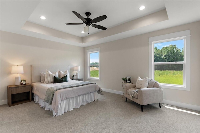 6766 Baldwin St, Hudsonville, MI 49426 - bedroom featuring a tray ceiling, light colored carpet, recessed lighting, and ceiling fan