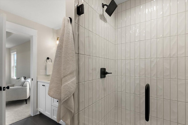 6766 Baldwin St, Hudsonville, MI 49426 - ensuite bathroom with tiled shower, vanity, and tile patterned flooring