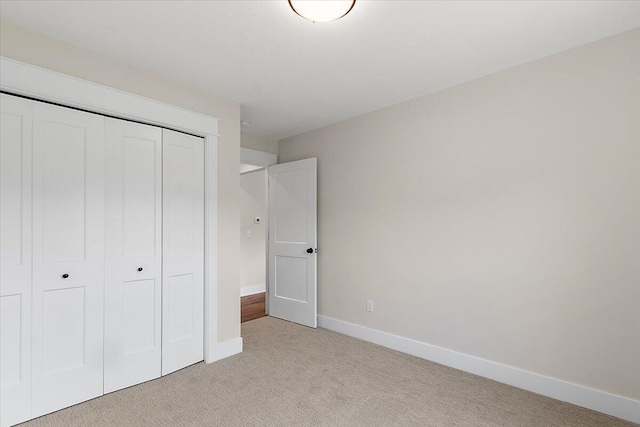 6766 Baldwin St, Hudsonville, MI 49426 - unfurnished bedroom featuring light carpet and a closet