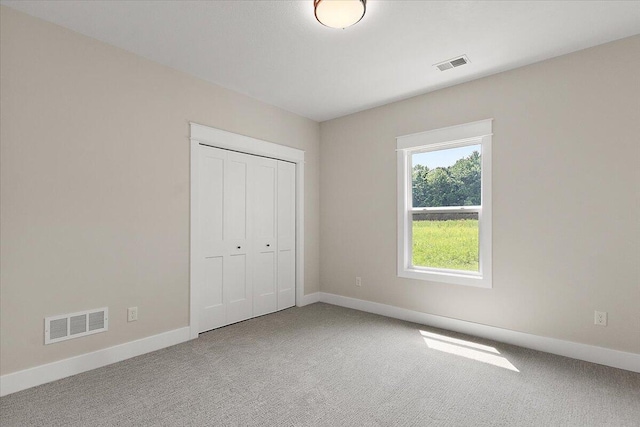 6766 Baldwin St, Hudsonville, MI 49426 - unfurnished bedroom featuring carpet floors and a closet