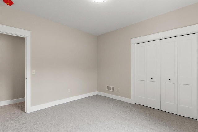 6766 Baldwin St, Hudsonville, MI 49426 - unfurnished bedroom featuring light colored carpet and a closet