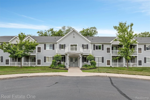 1127 S Lake Dr Unit 212, Novi, MI 48377 - view of front of property featuring a front lawn