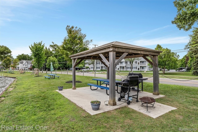 1127 S Lake Dr Unit 212, Novi, MI 48377 - view of community with a gazebo, a lawn, an outdoor fire pit, and a patio