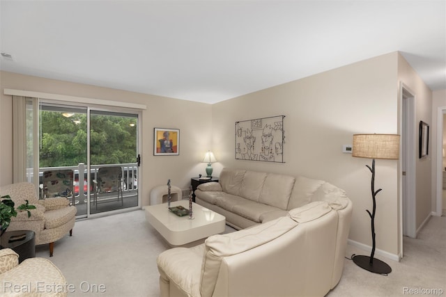 1127 S Lake Dr Unit 212, Novi, MI 48377 - living room with light colored carpet and baseboards