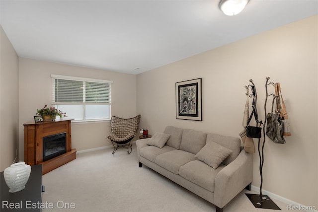 1127 S Lake Dr Unit 212, Novi, MI 48377 - carpeted living room featuring baseboards and a glass covered fireplace