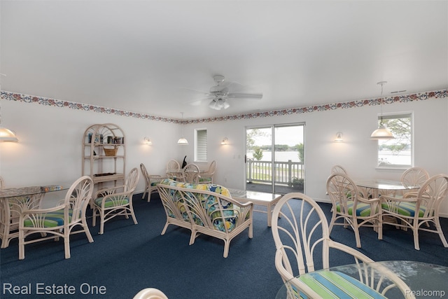 1127 S Lake Dr Unit 212, Novi, MI 48377 - dining room with carpet floors, healthy amount of natural light, and a ceiling fan