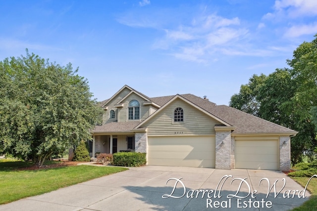 2711 Byron Station Dr SW, Byron Center, MI 49315 - traditional home with driveway, roof with shingles, brick siding, and a garage