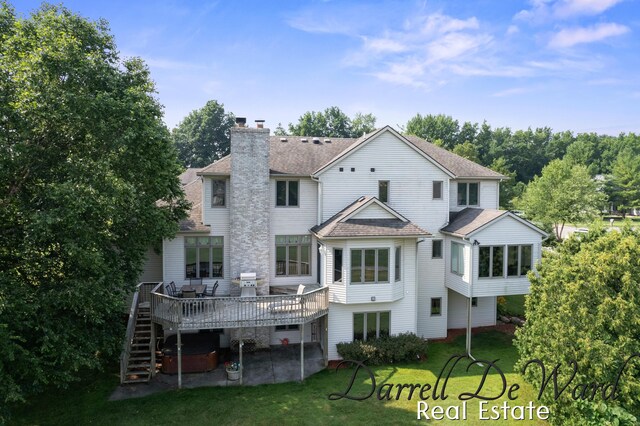 2711 Byron Station Dr SW, Byron Center, MI 49315 - back of property featuring stairs, a shingled roof, a wooden deck, a chimney, and a lawn