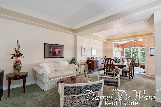 2711 Byron Station Dr SW, Byron Center, MI 49315 - carpeted living room featuring a raised ceiling and a chandelier