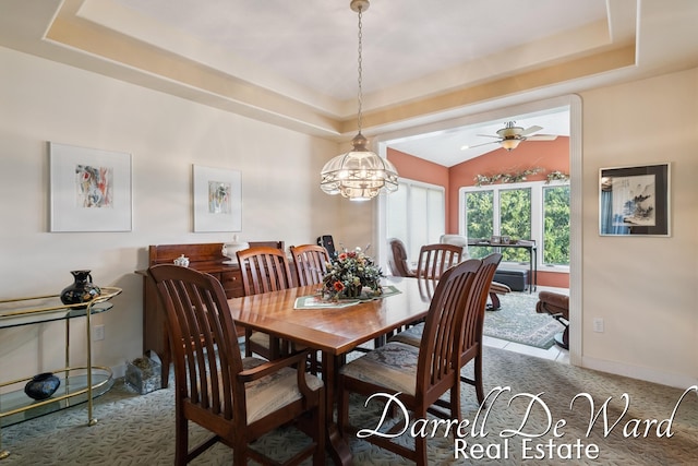 2711 Byron Station Dr SW, Byron Center, MI 49315 - dining room with carpet, a raised ceiling, a ceiling fan, a chandelier, and vaulted ceiling