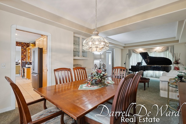 2711 Byron Station Dr SW, Byron Center, MI 49315 - dining area featuring a raised ceiling, carpet flooring, and a chandelier