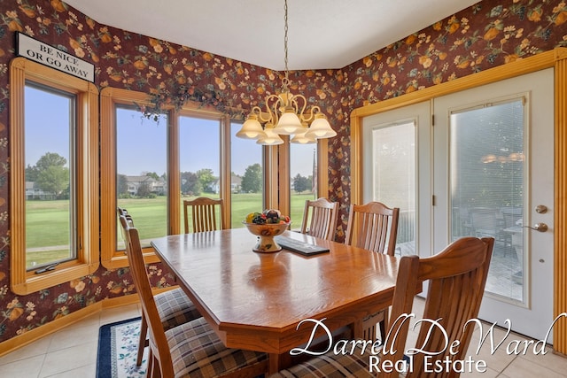 2711 Byron Station Dr SW, Byron Center, MI 49315 - dining area with wallpapered walls, a chandelier, light tile patterned floors, and healthy amount of natural light