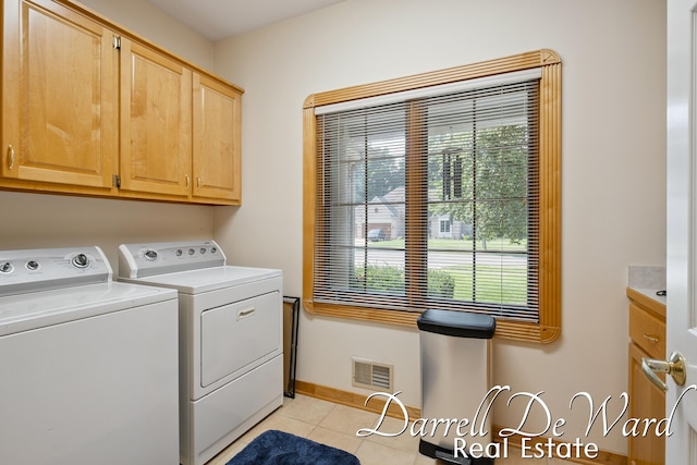 2711 Byron Station Dr SW, Byron Center, MI 49315 - laundry area featuring washing machine and dryer, cabinet space, healthy amount of natural light, and light tile patterned floors