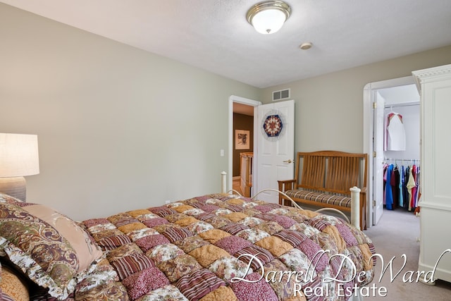 2711 Byron Station Dr SW, Byron Center, MI 49315 - bedroom with light carpet and a walk in closet