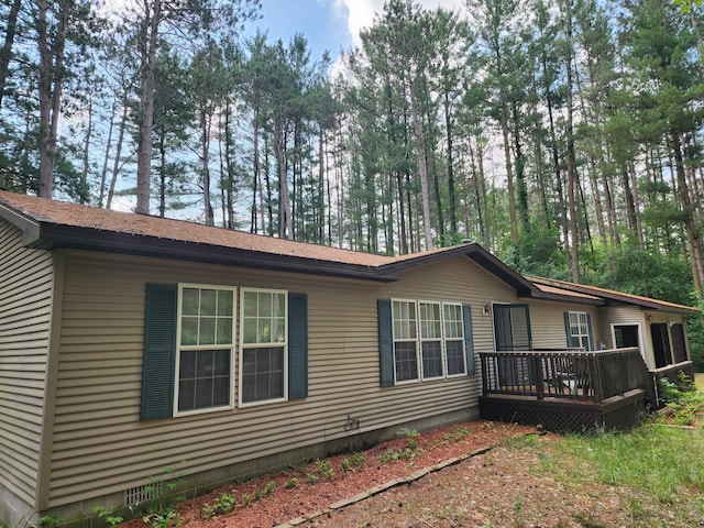 3930 Brenlor Ave, Hesperia, MI 49421 - view of home's exterior with a wooden deck and crawl space