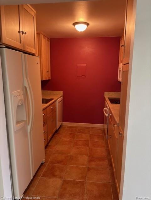2120 Pauline Blvd Unit 305, Ann Arbor, MI 48103 - kitchen featuring white appliances, light countertops, and tile patterned floors