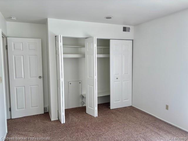 2120 Pauline Blvd Unit 305, Ann Arbor, MI 48103 - unfurnished bedroom featuring carpet flooring and multiple closets