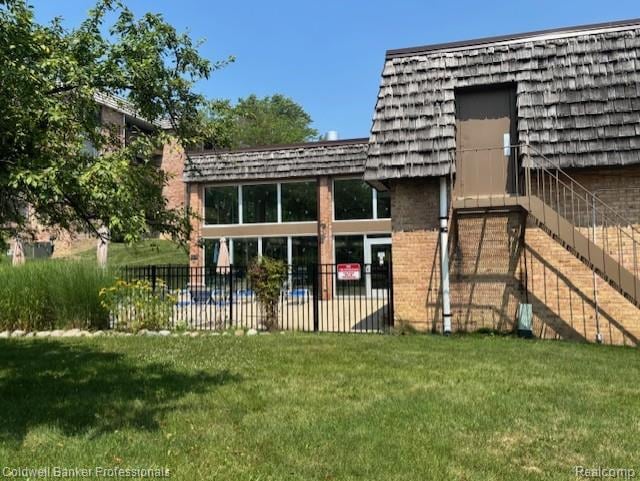 2120 Pauline Blvd Unit 305, Ann Arbor, MI 48103 - exterior space with mansard roof and brick siding