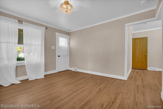1221 E 13 Mile Rd, Royal Oak, MI 48073 - unfurnished room featuring ornamental molding, wood finished floors, and a chandelier