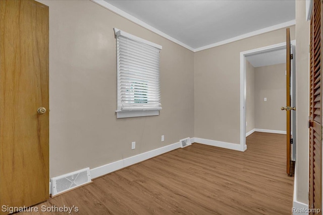 1221 E 13 Mile Rd, Royal Oak, MI 48073 - spare room with wood finished floors and ornamental molding