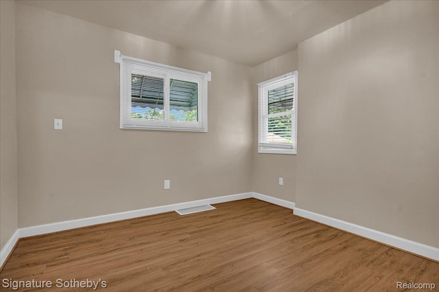 1221 E 13 Mile Rd, Royal Oak, MI 48073 - spare room with baseboards and wood finished floors