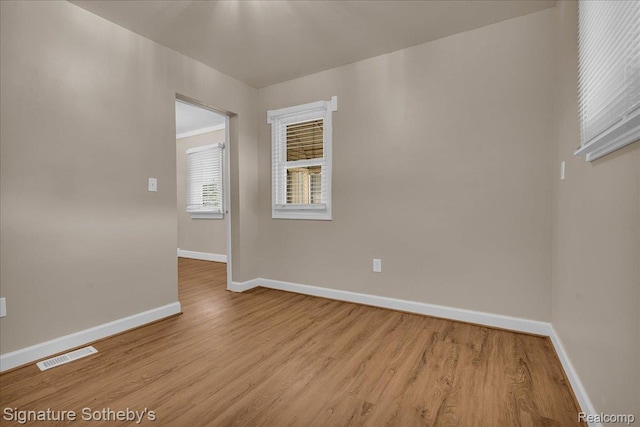 1221 E 13 Mile Rd, Royal Oak, MI 48073 - empty room featuring baseboards and light wood-type flooring