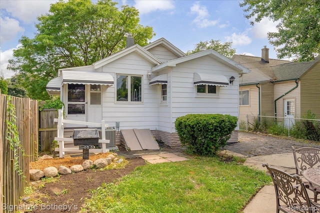 1221 E 13 Mile Rd, Royal Oak, MI 48073 - back of house with a chimney