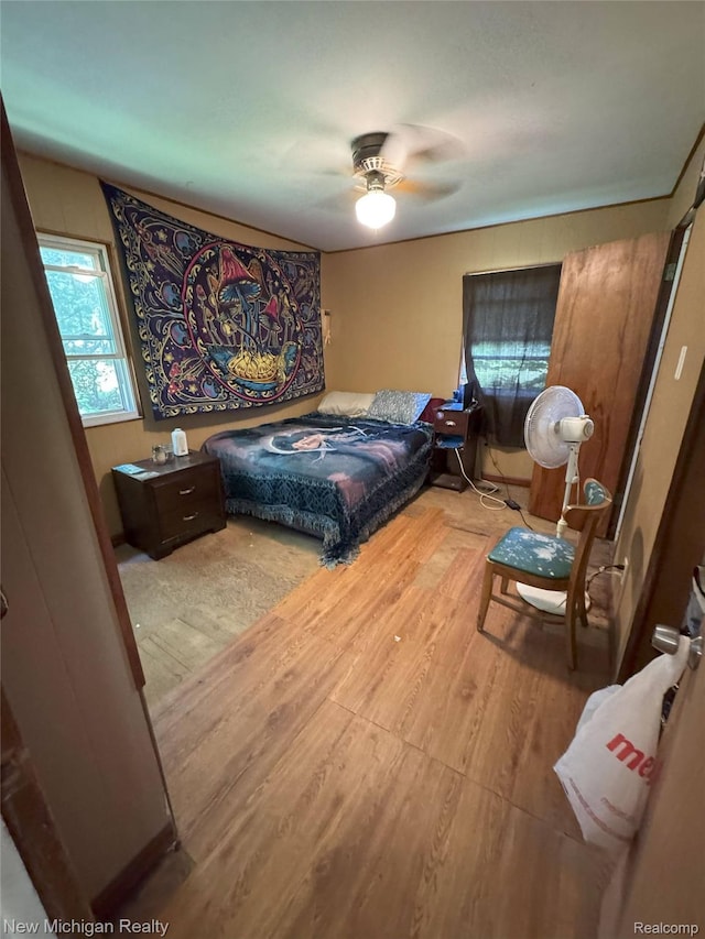 5407 Ostrom Rd, Attica, MI 48412 - bedroom featuring wood finished floors and a ceiling fan