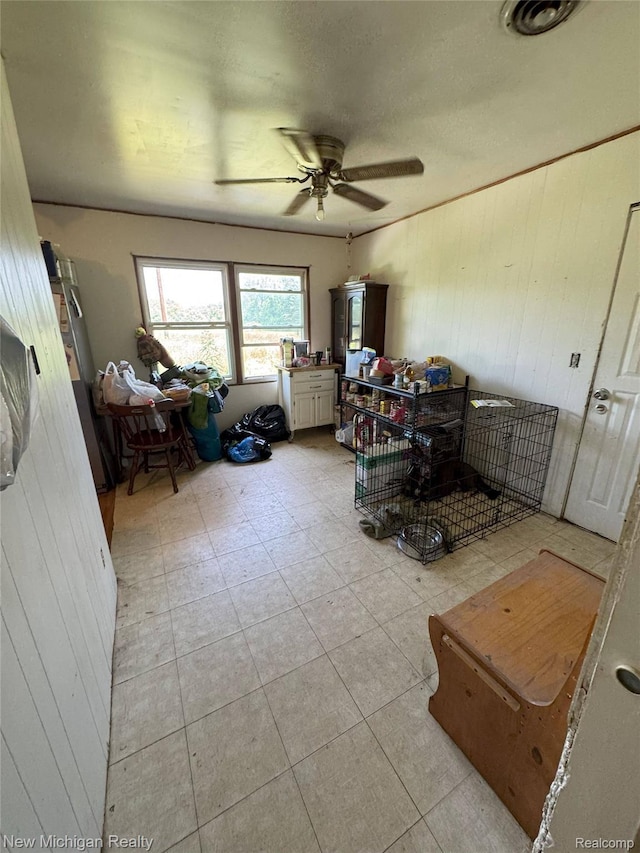 5407 Ostrom Rd, Attica, MI 48412 - bedroom featuring wooden walls and light tile patterned flooring