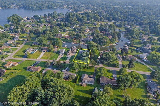 1830 Majon, Highland, MI 48356 - aerial view of residential area featuring property boundaries highlighted and a nearby body of water