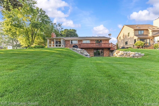 1830 Majon, Highland, MI 48356 - rear view of house featuring a sunroom, a deck, brick siding, and a chimney