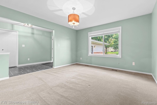 1830 Majon, Highland, MI 48356 - spare room featuring carpet flooring and baseboards
