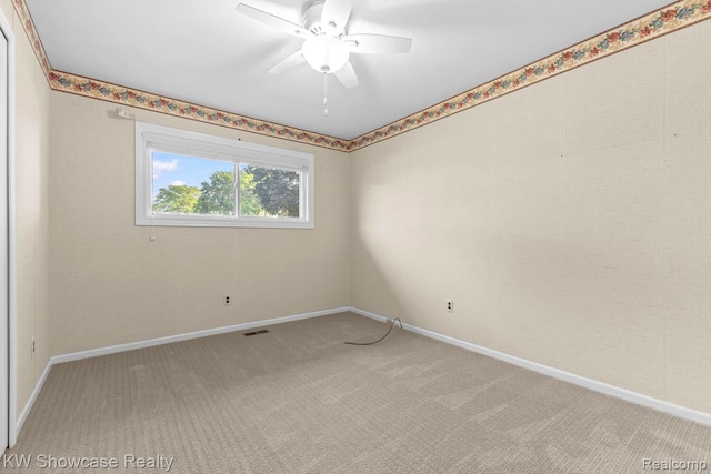 1830 Majon, Highland, MI 48356 - spare room featuring light carpet and ceiling fan
