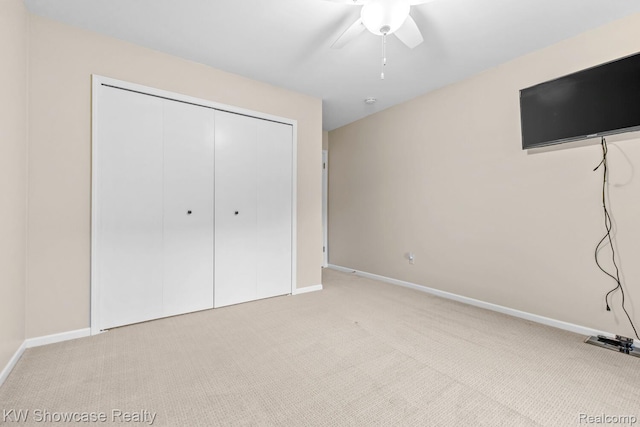 1830 Majon, Highland, MI 48356 - unfurnished bedroom featuring light colored carpet, a closet, and a ceiling fan