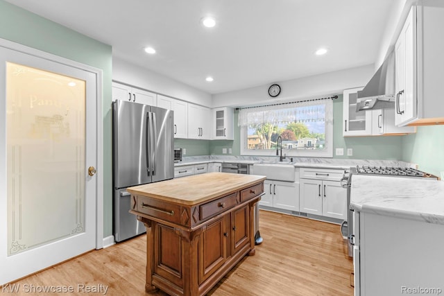 1830 Majon, Highland, MI 48356 - kitchen with wood counters, stainless steel appliances, light wood-style flooring, white cabinetry, and recessed lighting