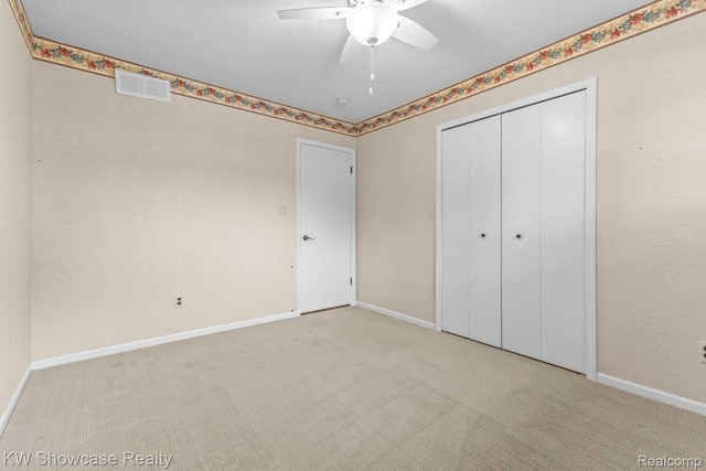 1830 Majon, Highland, MI 48356 - unfurnished bedroom with carpet flooring, a closet, and a ceiling fan