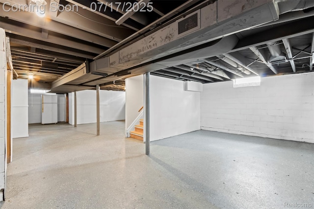 7235 Stout St, Detroit, MI 48228 - finished basement featuring stairs and freestanding refrigerator