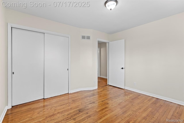 7235 Stout St, Detroit, MI 48228 - unfurnished bedroom featuring wood finished floors and a closet