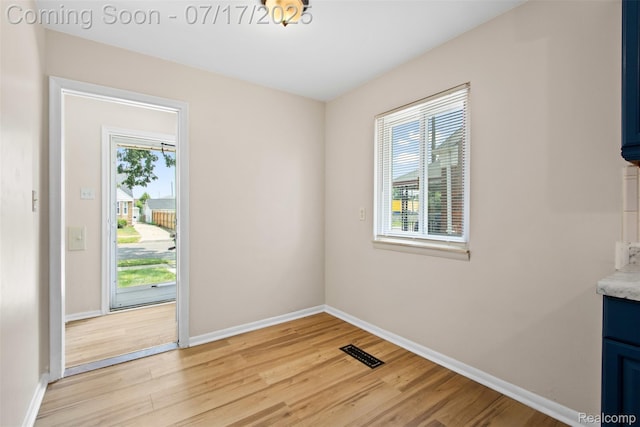7235 Stout St, Detroit, MI 48228 - unfurnished dining area featuring light wood-style flooring and baseboards