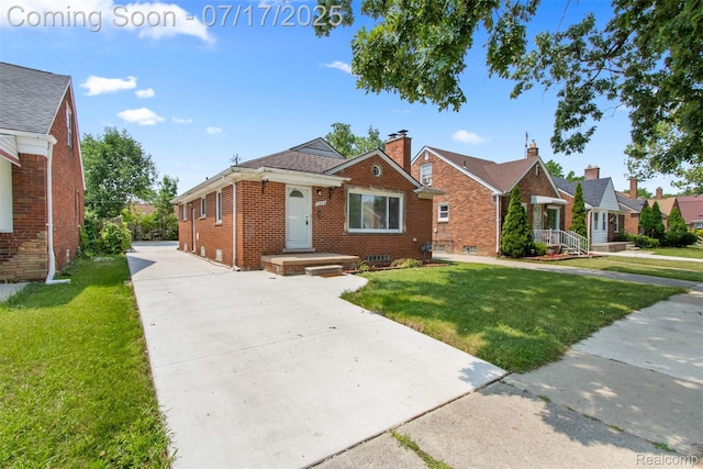7235 Stout St, Detroit, MI 48228 - bungalow-style house featuring brick siding, a front yard, a chimney, and driveway