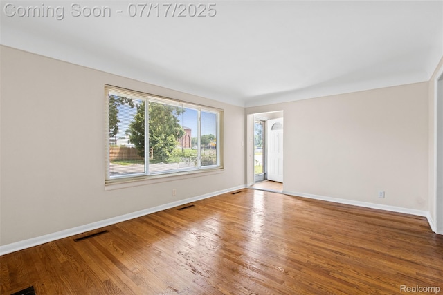 7235 Stout St, Detroit, MI 48228 - spare room with baseboards and wood finished floors