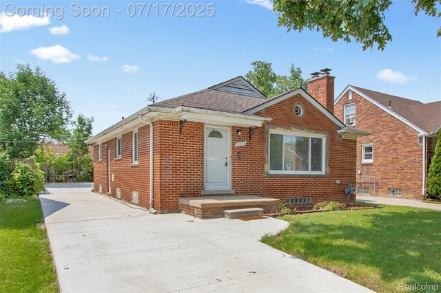 7235 Stout St, Detroit, MI 48228 - view of front of house featuring brick siding, driveway, a chimney, and a front lawn