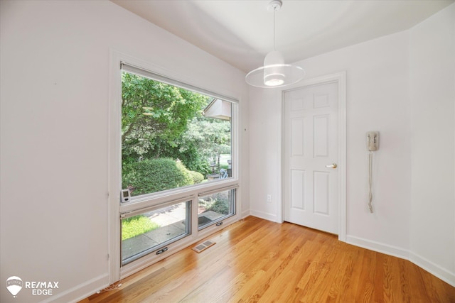 8078 Hawkcrest Dr, Grand Blanc, MI 48439 - unfurnished room with light wood finished floors and baseboards